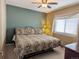 Spacious bedroom with king-size bed and ceiling fan at 15602 E Dorado Pl, Centennial, CO 80015