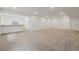 Spacious basement with a partial bar area, offering potential for customization and entertainment at 8630 Pennycress Dr, Littleton, CO 80125