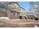 Backyard with deck, stone border, and patio featuring pergola at 2835 S Jebel Way, Aurora, CO 80013