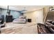 Basement bedroom features a queen sized bed, a sofa, and neutral carpeting at 2835 S Jebel Way, Aurora, CO 80013