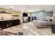 Basement bedroom with a wet bar, large bed, and stylish decor at 2835 S Jebel Way, Aurora, CO 80013