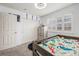 Bright bedroom with a twin size bed, natural light, a closet and a dresser for storage at 2835 S Jebel Way, Aurora, CO 80013