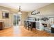 Bright dining area features hardwood floors, a chandelier, and sliding door access to the deck at 2835 S Jebel Way, Aurora, CO 80013