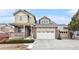 Charming two-story home with a brick and siding facade and attached two-car garage at 2835 S Jebel Way, Aurora, CO 80013