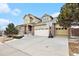 Beautiful home with a two-car garage and a well-maintained lawn and front porch at 2835 S Jebel Way, Aurora, CO 80013