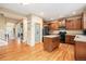 Spacious kitchen with dark cabinets, stainless steel appliances, and a central island at 2835 S Jebel Way, Aurora, CO 80013