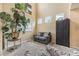 Spacious living room featuring a comfortable sofa and a large window for natural light at 2835 S Jebel Way, Aurora, CO 80013
