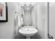 Clean lines and simple design in this small bathroom at 1245 N Utica St # 103, Denver, CO 80204