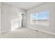 Bright bedroom with a window, carpet flooring, and ensuite bathroom at 1245 N Utica St # 103, Denver, CO 80204