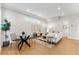 Bright and airy living room with stylish decor and hardwood floors at 1245 N Utica St # 103, Denver, CO 80204