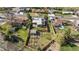 Aerial view of a property with a large, fenced backyard featuring a garden, shed, patio, and mature trees at 3035 E Maplewood Ave, Centennial, CO 80121