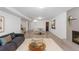 Spacious basement with a comfortable living area, dining space, and fireplace feature at 3035 E Maplewood Ave, Centennial, CO 80121
