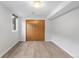 Neutral bedroom with light floors, closet with sliding doors, and plenty of natural light at 3035 E Maplewood Ave, Centennial, CO 80121