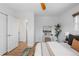 Bright bedroom with white walls, hardwood floors, and simple yet elegant decor at 3035 E Maplewood Ave, Centennial, CO 80121