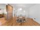 Cozy dining area with modern lighting, hardwood floors, and seating for four at 3035 E Maplewood Ave, Centennial, CO 80121