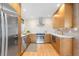 Well-appointed kitchen with stainless steel appliances, modern cabinetry, and ample counter space at 3035 E Maplewood Ave, Centennial, CO 80121