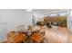 Open-concept living area with hardwood floors, stylish furniture, and ample natural light at 3035 E Maplewood Ave, Centennial, CO 80121