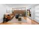 Bright living room featuring hardwood floors, ample natural light, and stylish contemporary furnishings at 3035 E Maplewood Ave, Centennial, CO 80121
