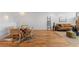 Open-concept living area with hardwood floors, stylish furniture, and ample natural light at 3035 E Maplewood Ave, Centennial, CO 80121