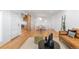 Open-concept living area with hardwood floors, stylish furniture, and ample natural light at 3035 E Maplewood Ave, Centennial, CO 80121