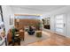 Bright living room featuring hardwood floors, ample natural light, and stylish contemporary furnishings at 3035 E Maplewood Ave, Centennial, CO 80121