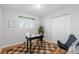 Charming office with wood floors, natural light, and a cozy rug, creating an inviting workspace at 3035 E Maplewood Ave, Centennial, CO 80121