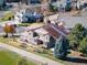 Beautiful aerial view of a luxurious home in a well-maintained community, and mature trees at 16226 River Haven Way, Morrison, CO 80465