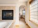 View of bathroom with archway to main bedroom and stained glass window at 16226 River Haven Way, Morrison, CO 80465