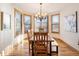 Dining room with a wooden table, bench seating, and large windows with lots of natural light at 16226 River Haven Way, Morrison, CO 80465