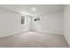 Finished basement bedroom with neutral carpet, white paneled walls, and window at 13010 W 6Th Pl, Golden, CO 80401
