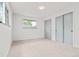 Bedroom with two windows offering natural light and closet with sliding door at 13010 W 6Th Pl, Golden, CO 80401