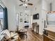 Cozy living room features hardwood floors, ceiling fan, and open access to bedroom at 962 S Dearborn Way # 19, Aurora, CO 80012