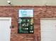 Sable Cove Condominiums sign over map of buildings and parking areas, on the exterior of a brick building at 962 S Dearborn Way # 19, Aurora, CO 80012