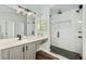 Contemporary bathroom featuring a glass enclosed shower and vanity with modern fixtures at 6071 Russell Ln, Arvada, CO 80403