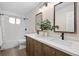 Elegant bathroom with double sink vanity, modern fixtures, and updated shower at 6071 Russell Ln, Arvada, CO 80403