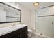 Modern bathroom with sleek vanity, glass-enclosed shower, and contemporary fixtures for a spa-like experience at 6071 Russell Ln, Arvada, CO 80403