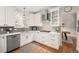 Beautiful kitchen featuring stainless appliances, quartz counters, and bright light at 6071 Russell Ln, Arvada, CO 80403