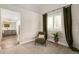 Bright main bedroom with an ensuite bathroom and plantation shutters offering natural light at 6071 Russell Ln, Arvada, CO 80403