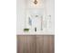 Elegant bathroom vanity features modern fixtures and cabinet at 3433 Lawrence St # 1, Denver, CO 80205
