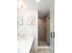 Stylish bathroom boasts glass shower with modern fixtures and a sleek vanity sink at 3433 Lawrence St # 1, Denver, CO 80205
