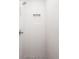 Elegant shower features white tile walls, gray hexagonal tile floor, and a convenient recessed niche at 3433 Lawrence St # 1, Denver, CO 80205