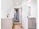Bathroom boasts modern vanity, wood floors, and stylish fixtures at 3433 Lawrence St # 1, Denver, CO 80205