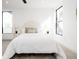 Bright bedroom features large windows, stylish furnishings and modern interior design at 3433 Lawrence St # 1, Denver, CO 80205