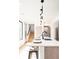 Modern kitchen featuring seating at the island, stainless appliances, and bright natural light at 3433 Lawrence St # 1, Denver, CO 80205