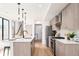 Kitchen featuring stainless appliances, ample counter space, and modern lighting at 3433 Lawrence St # 1, Denver, CO 80205