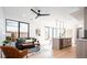 Relaxing living room featuring recessed lighting, modern furniture and large windows at 3433 Lawrence St # 1, Denver, CO 80205