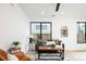 Stylish living room features modern furniture, decor and natural lighting at 3433 Lawrence St # 1, Denver, CO 80205