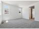 Large carpeted bedroom with two windows featuring excellent natural light at 8241 Rockvale Dr, Littleton, CO 80125