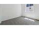 A carpeted bedroom with a window and white walls; excellent natural light at 8241 Rockvale Dr, Littleton, CO 80125