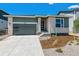 Attractive single-Gathering home showcasing a modern design, a well-manicured lawn, and neutral colors at 8241 Rockvale Dr, Littleton, CO 80125